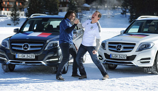 Christian Karembeu (l.), Andreas Möller und ihre Mercedes GLKs