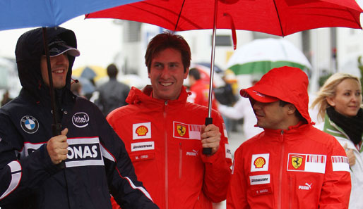 Regen beim Weg in die Startaufstellung: Robert Kubica (links) will die WM-Führung zurück - und zwar von Felipe Massa (rechts)