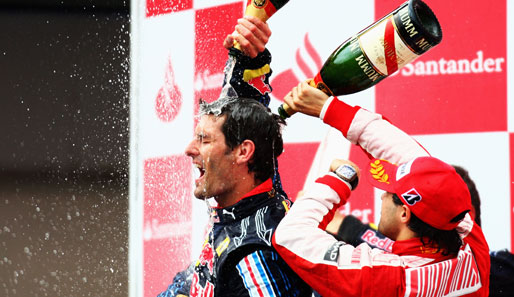 Begossener Pudel, ähm Australier. Felipe Massa freut sich über Platz drei und spendiert Webber eine standesgemäße Champagner-Dusche auf dem Podium