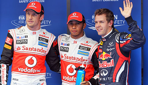 Aber wer hat hier eigentlich die Pole-Position geholt? Vettel (r.) und Jenson Button (l.) sahen irgendwie glücklicher aus als Triumphator Hamilton
