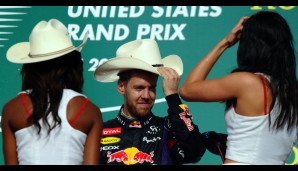 Teamkollege Sebastian Vettel zog derweil lieber die Grid Girls aus - zumindest die Hüte