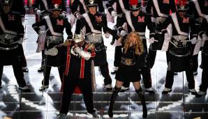 2012 in Indianapolis wurde geklotzt und nicht gekleckert: Madonna höchstpersönlich machte Bühnengymnastik und wurde dabei komplettiert von Cee Lo Green, LMFAO, Nicki Minaj und M.I.A. - Letztere zeigte dem Publikum ganz unartig den Mittelfinger.