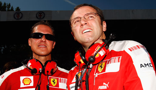 Michael Schumacher (l.) und Stefano Domenicali 2009 beim Italien-GP in Monza