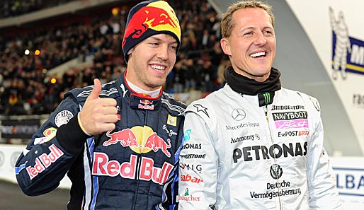 Michael Schumacher (r.) ist immer noch das Vorbild von Sebastian Vettel