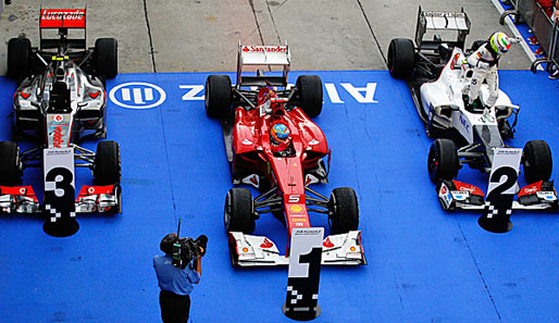 Die drei Podiums-Autos in Sepang: McLaren, Ferrari, Sauber (v.l.)