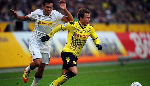 Götze (r.) ist mit Borussia Dortmund derzeit auf der Überholspur - und das soll bis 2016 so bleiben