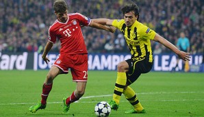 Thomas Müller (l.) glaubt an ein spannendes Duell mit Borussia Dortmund