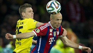 Arjen Robben (r.) will seinen Vertrag in München erfüllen
