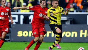 Stefan Reinartz (M.) gewann mit Bayer das Auftaktspiel in Dortmund