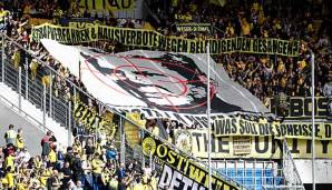 Brisantes Banner: Im Hinspiel präsentieren BVB-Fans eine Blockfahne mit dem Konterfei von Hoffenheims Mäzen Dietmar Hopp im Zentrum eines Fadenkreuzes.