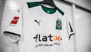 Borussia Mönchengladbach: Hauptfarbe des Heimtrikots bleibt bei den Gladbachern das traditionelle Weiß. Komplettiert wird das durch einen grün-schwarzen Kragen. Auch das Logo ist auf grünen Hintergrund gebettet.