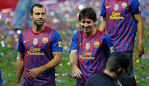 Javier Mascherano (l.) traut Teamkollege Lionel Messi (r.) zu, eine Legende zu werden