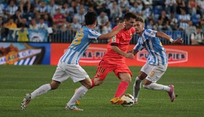 Lionel Messi (M.) kam mit Barcelona gegen Malaga nur zu einem torlosen Remis
