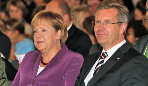 Angela Merkel (l.) und Christian Wulff stehen hinter Münchens Bewerbung