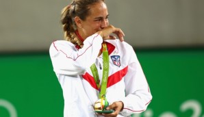 RIO DE JANEIRO, BRAZIL - AUGUST 13: Gold medalist Monica Puig of Puerto Rico reacts during the medal ceremony for Women's Singles on Day 8 of the Rio 2016 Olympic Games at the Olympic Tennis Centre on August 13, 2016 in Rio de Janeiro, Brazil. (Pho...