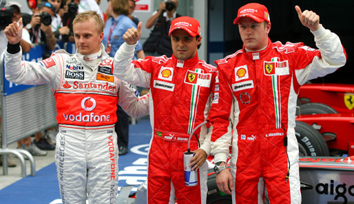 Auf Platz drei kam Heikki Kovalainen (links) im McLaren-Mercedes - und ließ sich mit dem Ferrari-Duo feiern