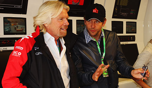 Auch die Prominenz war natürlich wieder vor Ort: "Hangover"-Star Bradley Cooper (r.) mit Richard Branson, Chef von Marussia Virgin Racing