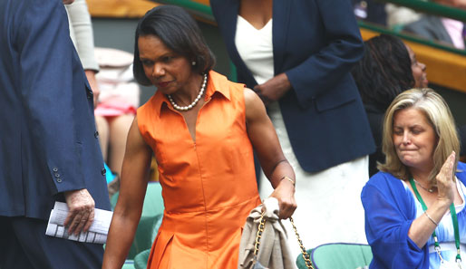 Nicht als Catwoman, sondern als oranges Etwas sucht die ehemalige US-Außenministerin Condoleezza Rice ihren Platz