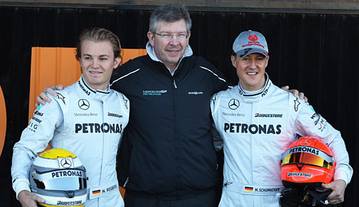 Ross Brawn mit seinen Fahrern Michael Schumacher (r.) und Nico Rosberg (l.)