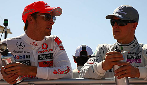 Jenson Button (l.) kritisierte Michael Schumacher nach dem Rennen für dessen Überholmanöver