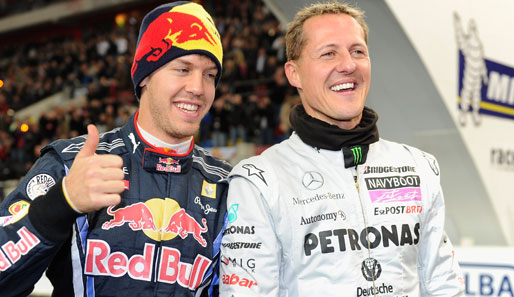 Michael Schumacher (r.) würde Sebastian Vettel gerne im Mercedes fahren sehen