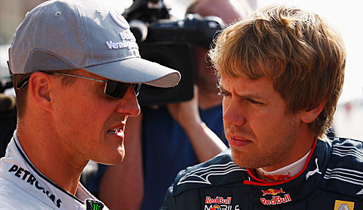 Michael Schumacher (l.) und Sebastian Vettel geben sich in Kerpen die Ehre