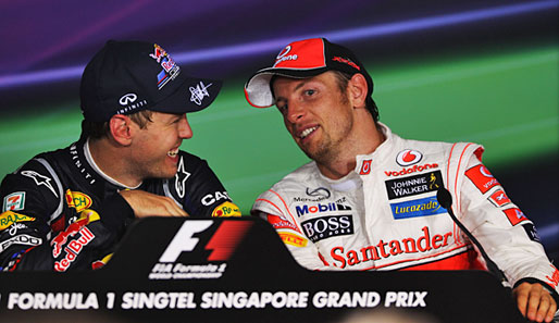 Jenson Button (r.) ist der Einzige, der Sebastian Vettel die WM theoretisch noch abjagen könnte