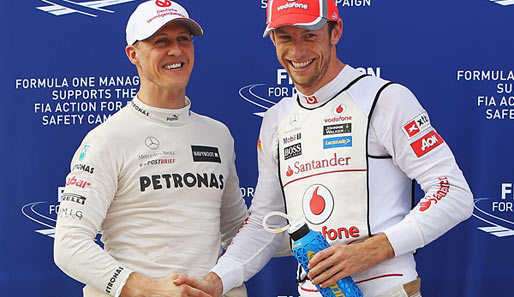Michael Schumacher (l.) und Jenson Button waren die großen Verlierer des Kanada-GP