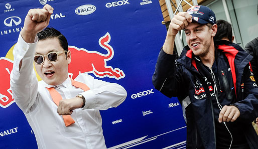 Vor dem Rennen tanzte Sebastian Vettel (r.) vergnügt mit Poprapper Psy zum Lied "Gangnam Style"