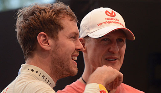 Titelverteidiger Sebastian Vettel (l.) erwartet laut Schumacher eine enge Saison