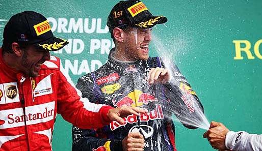 Fernando Alonso (l.) und Sebastian Vettel (r.) ließen sich nach dem Kanada-GP zurecht feiern