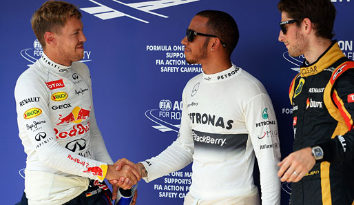 Lewis Hamilton (M.) startet am Sonntag im Rennen vor Sebastian Vettel (l.) und Romain Grosjean