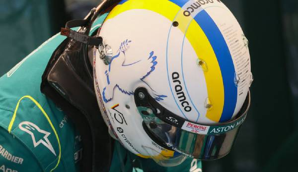 Sebastian Vettel will mit seinem Helm ein Zeichen für den Frieden setzen.