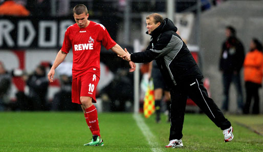 Köln-Coach Frank Schaefer (re.) hofft auf den Einsatz von Lukas Podolski