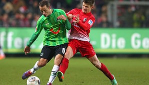 Steven Cherundolo (l.) machte gegen Freiburg im Dezember 2013 sein letztes Spiel für 96