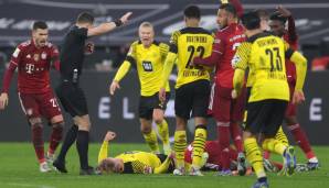 Eine der Schrecksekunden dieser Saison: Julian Brandt geht im Kracher gegen die Bayern zu Boden und bleibt bewusstlos liegen.