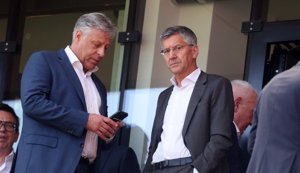 The moment they found out the news had been pushed through?  FC Bayern President Herbert Hainer (right) and Head of Communications Stefan Mennerich.