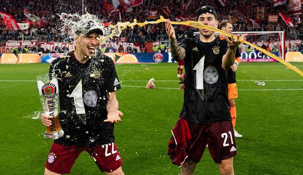 Bayern professionals Marc Roca (left) and Lucas Hernandez celebrate the German championship after beating Dortmund a week ago.