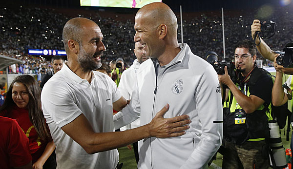 Pep Guardiola (l.) hat großes Lob von Zinedine Zidane erhalten.
