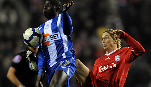 Kein Durchkommen: Liverpools Fernando Torres (r.) ging gegen Wigan und Mohamed Diame leer aus