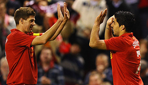 Darling, stand by me: Reds Kapitän Steven Gerrard (l.) möchte nicht auf Luis Suarez verzichten