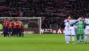 Die Mannschaften von Evian und Lille legten vor dem Spiel eine Schweigeminute ein
