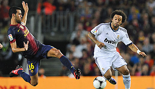 Der elegante Sergio Busquets (l.) kann auch anders: Hier im Duell mit Real Madrids Marcelo