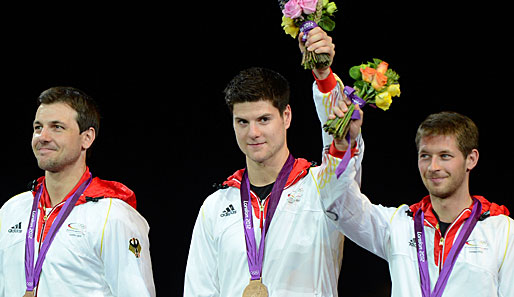 Timo Boll (l.) und Dimitrij Ovtcharov (M.) gewannen bei Olympia 2012 Team-Bronze