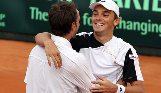 Andreas Beck (r.) schied bei den US Open in der zweiten Runde gegen Roger Federer aus