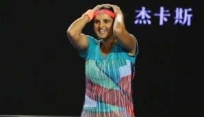 MELBOURNE, AUSTRALIA - JANUARY 29: Sania Mirza of India celebrates winning championship point in her women's doubles final match with Martina Hingis of Switzerland against Andrea Hlavackova and Lucie Hradecka of the Czeck Republic during day 12 of t...